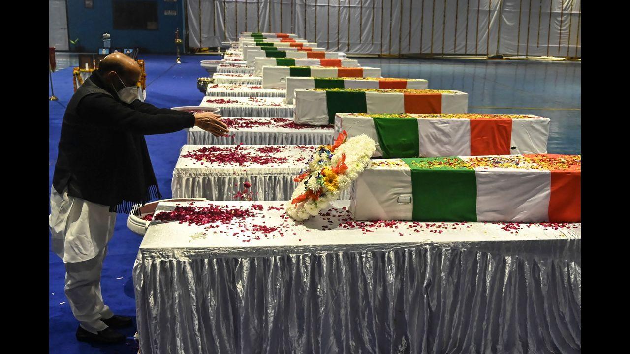 Defence Minister Rajnath Singh pays his final respects to CDS Bipin Rawat in New Delhi. Pic/PTI